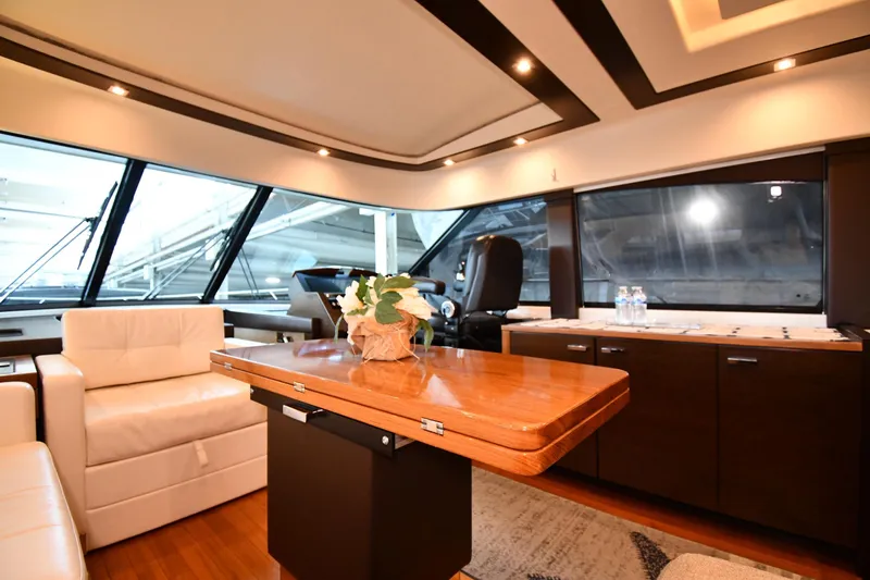 Slide: The Image of Luxurious interior of 2016 Tiara Yachts 50 Coupe with elegant seating and wooden table. - 41