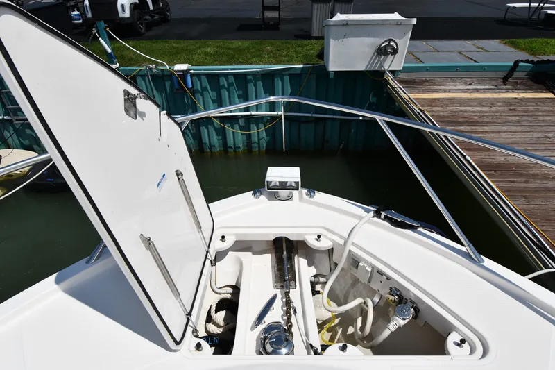 Slide: The Image of Open anchor locker on 2016 Tiara Yachts 50 Coupe at dockside. - 6