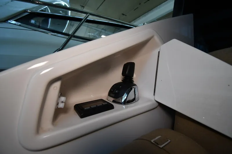 Slide: The Image of Control panel inside 2016 Tiara Yachts 50 Coupe, featuring joystick and buttons. - 57