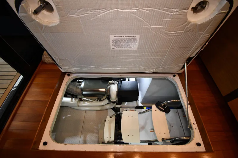 Slide: The Image of Engine compartment of a 2016 Tiara Yachts 50 Coupe, showcasing mechanical components. - 58