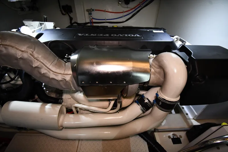 Slide: The Image of Engine room of a 2016 Tiara Yachts 50 Coupe featuring a Volvo Penta engine. - 62