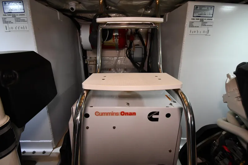 Slide: The Image of Engine room of 2016 Tiara Yachts 50 Coupe featuring Cummins Onan generator. - 63