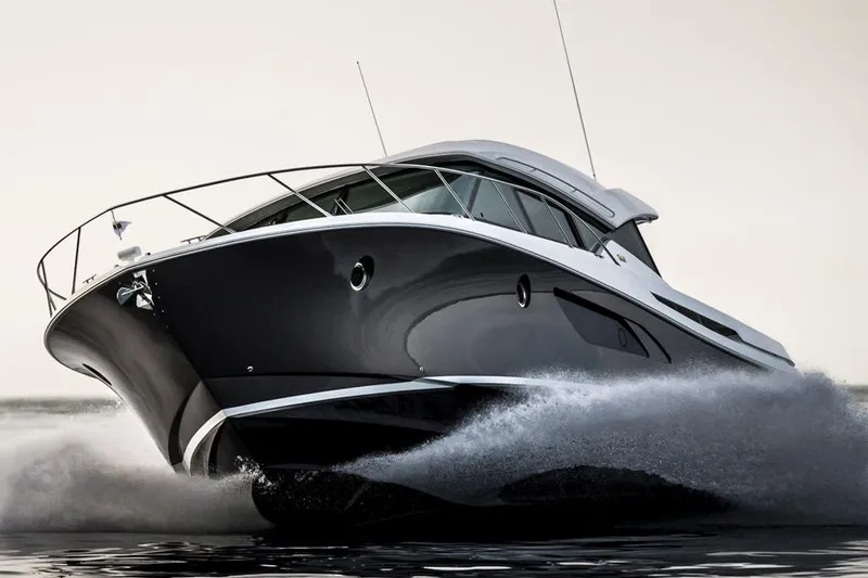 Slide: The Image of Manufacturer Provided Image: 2016 Tiara Yachts 50 Coupe cruising on water. - 7