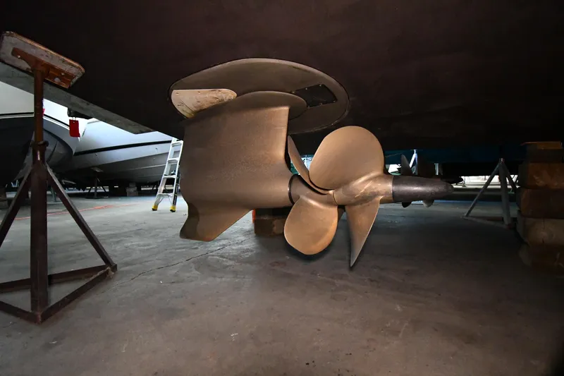 Slide: The Image of Propeller of 2016 Tiara Yachts 50 Coupe in dry dock, showcasing marine engineering. - 70