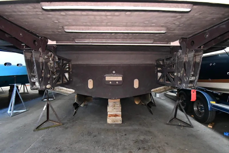 Slide: The Image of Underside view of a 2016 Tiara Yachts 50 Coupe on stands in a storage facility. - 72