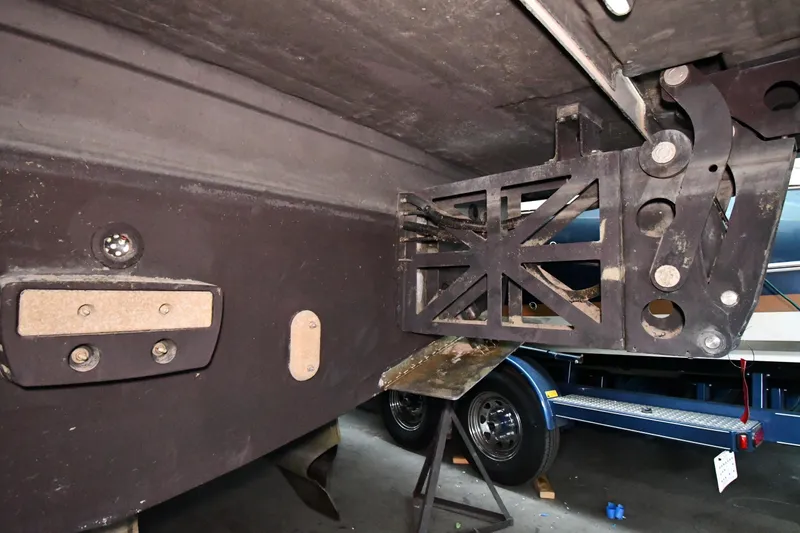 Slide: The Image of Underside view of a 2016 Tiara Yachts 50 Coupe, showcasing mechanical components. - 74