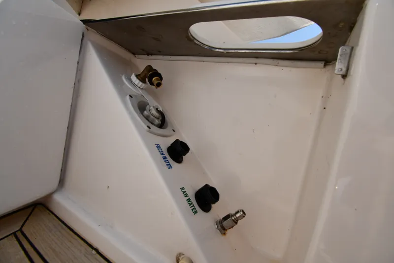 Slide: The Image of Water connections on 2016 Tiara Yachts 50 Coupe, labeled fresh and raw water. - 18