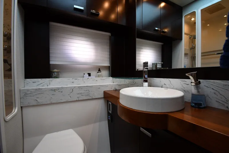 Slide: The Image of Luxurious bathroom interior of 2016 Tiara Yachts 50 Coupe with modern fixtures and marble accents. - 40