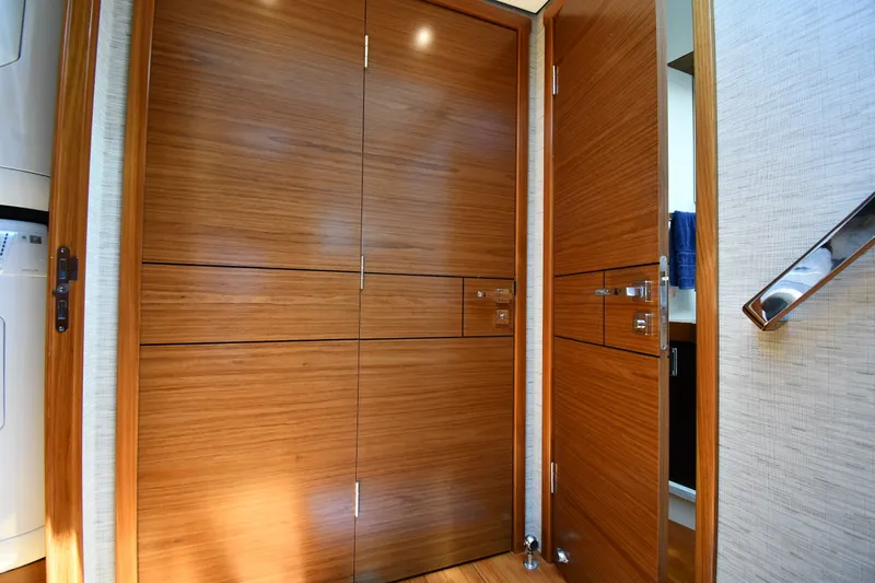 Slide: The Image of Interior of 2016 Tiara Yachts 50 Coupe featuring sleek wooden doors and modern design. - 29