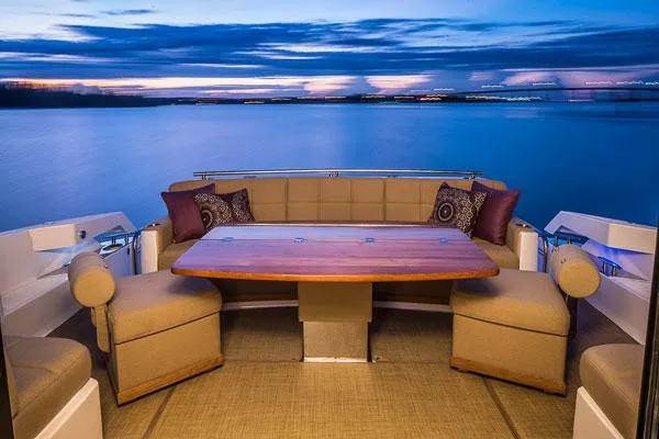 Slide: The Image of Manufacturer Provided Image: Luxury seating area on 2016 Tiara Yachts 50 Coupe at sunset. - 9