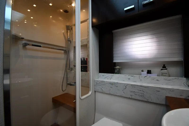 Slide: The Image of Luxurious bathroom interior of 2016 Tiara Yachts 50 Coupe with marble countertop and modern shower. - 41