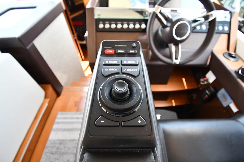 Slide: The Image of Control panel of a 2016 Tiara Yachts 50 Coupe, featuring Garmin navigation system. - 59
