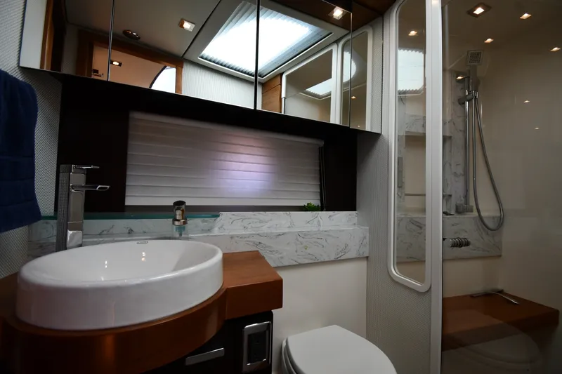 Slide: The Image of Luxurious bathroom interior of 2016 Tiara Yachts 50 Coupe, featuring modern fixtures and elegant design. - 32