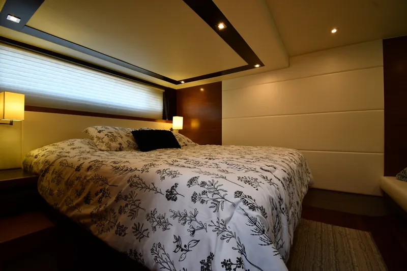 Slide: The Image of Luxurious bedroom interior of 2016 Tiara Yachts 50 Coupe with elegant bedding and ambient lighting. - 35