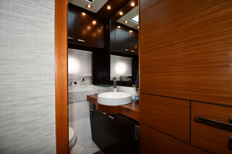 Slide: The Image of Luxurious bathroom interior of 2016 Tiara Yachts 50 Coupe with modern fixtures and wood accents. - 39