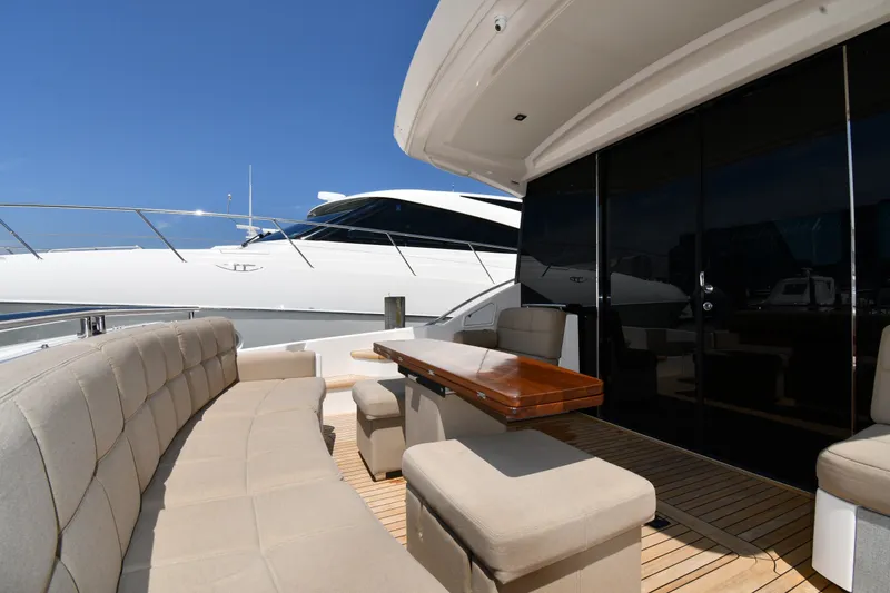 Slide: The Image of Luxurious 2016 Tiara Yachts 50 Coupe with elegant outdoor seating and sleek design. - 12