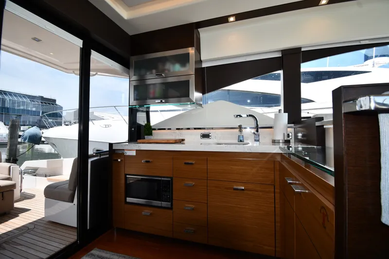 Slide: The Image of Luxurious 2016 Tiara Yachts 50 Coupe kitchen interior with modern amenities and sleek design. - 44