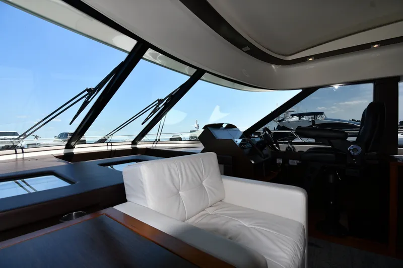 Slide: The Image of Interior of 2016 Tiara Yachts 50 Coupe with luxurious seating and panoramic windows. - 55