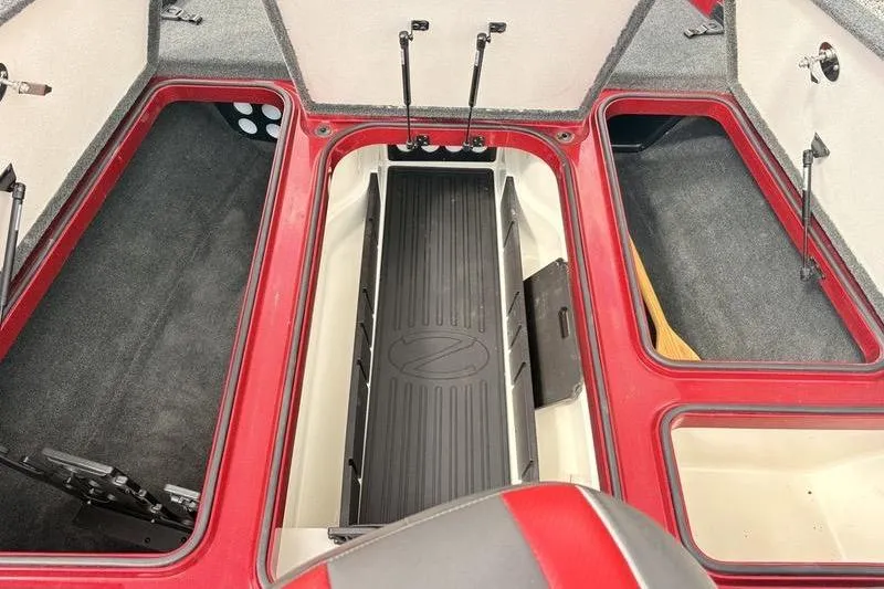 Slide: The Image of 2017 Ranger Z518 Comanche boat interior storage compartments, red and gray design. - 10