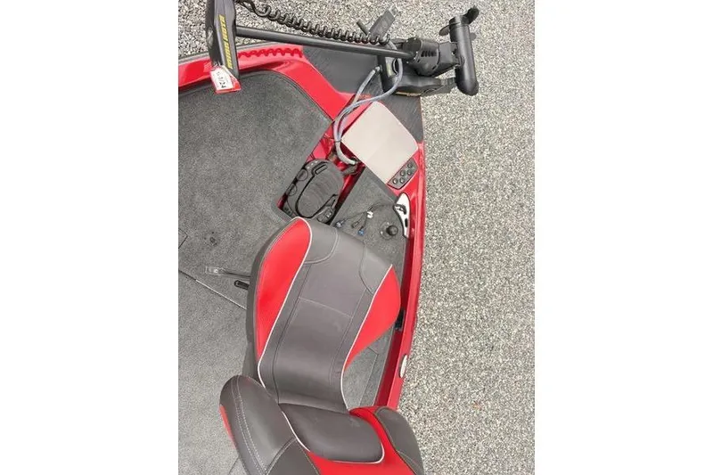 Slide: The Image of 2017 Ranger Z518 Comanche boat interior with red and black seating and control panel. - 11