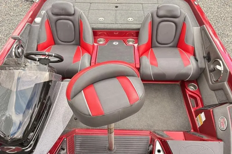 Slide: The Image of 2017 Ranger Z518 Comanche boat interior with red and gray seating. - 12