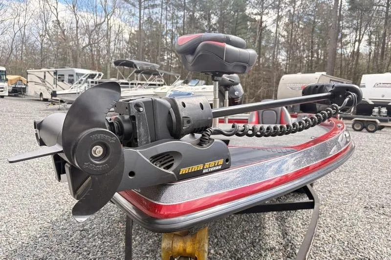 Slide: The Image of 2017 Ranger Z518 Comanche boat with Minn Kota trolling motor in a parking lot. - 4