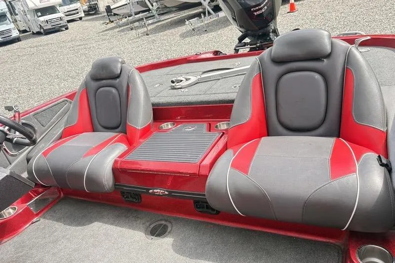 Slide: The Image of 2017 Ranger Z518 Comanche boat interior with red and gray seats. - 5