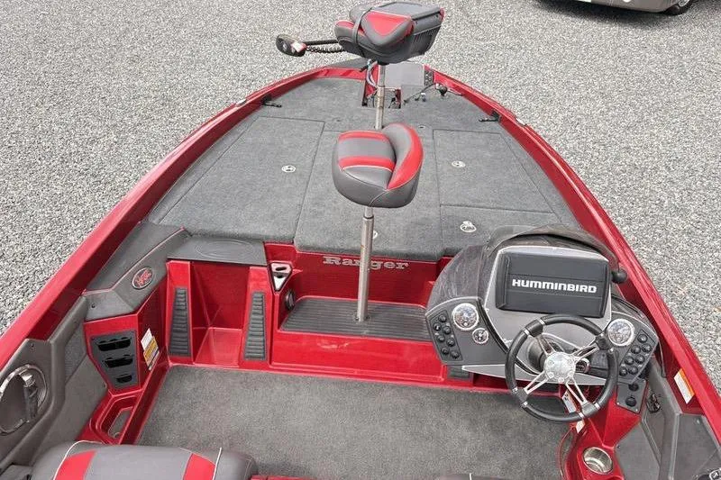 Slide: The Image of 2017 Ranger Z518 Comanche boat interior with Humminbird electronics and red accents. - 9