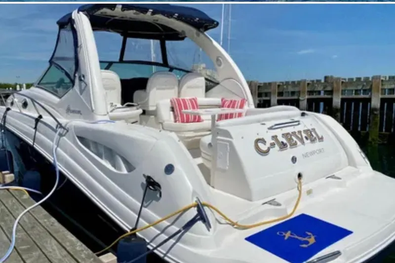 Slide: The Image of 2006 Sea Ray 340 Sundancer docked, featuring sleek design and comfortable seating. - 11