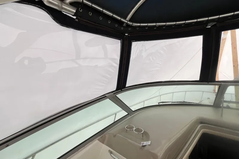 Slide: The Image of Interior view of 2006 Sea Ray 340 Sundancer boat with covered windows. - 22