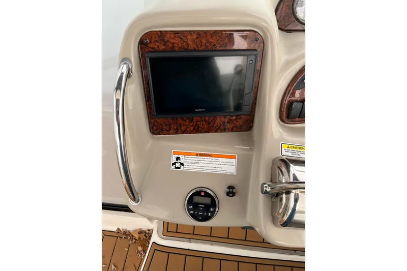 Slide: The Image of Control panel of a 2006 Sea Ray 340 Sundancer boat with navigation display. - 27