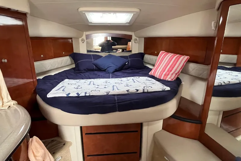 Slide: The Image of Luxurious cabin interior of 2006 Sea Ray 340 Sundancer yacht with cozy bedding. - 34
