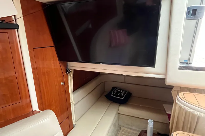 Slide: The Image of Interior of 2006 Sea Ray 340 Sundancer with TV and seating area. - 36