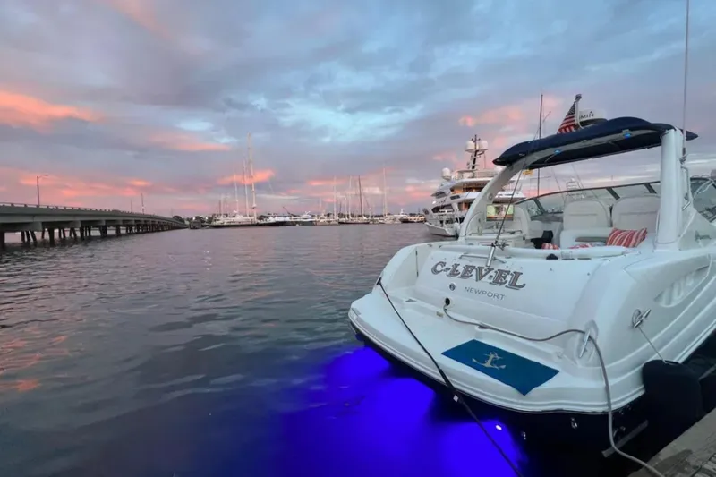 Slide: The Image of 2006 Sea Ray 340 Sundancer docked at sunset with vibrant sky and water reflections. - 4