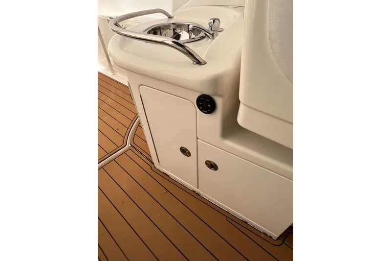 Slide: The Image of 2006 Sea Ray 340 Sundancer boat interior with sink and wooden flooring. - 40