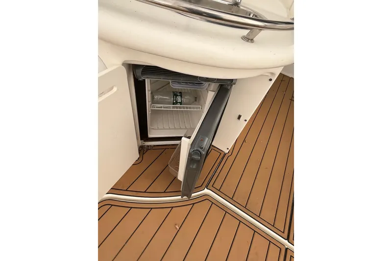 Slide: The Image of Open mini fridge on 2006 Sea Ray 340 Sundancer boat with teak flooring. - 41