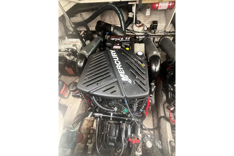 Slide: The Image of Engine compartment of a 2006 Sea Ray 340 Sundancer with Mercury engine. - 44