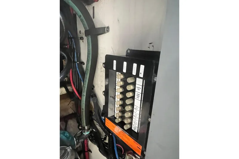 Slide: The Image of Electrical panel and wiring inside a 2006 Sea Ray 340 Sundancer boat. - 49