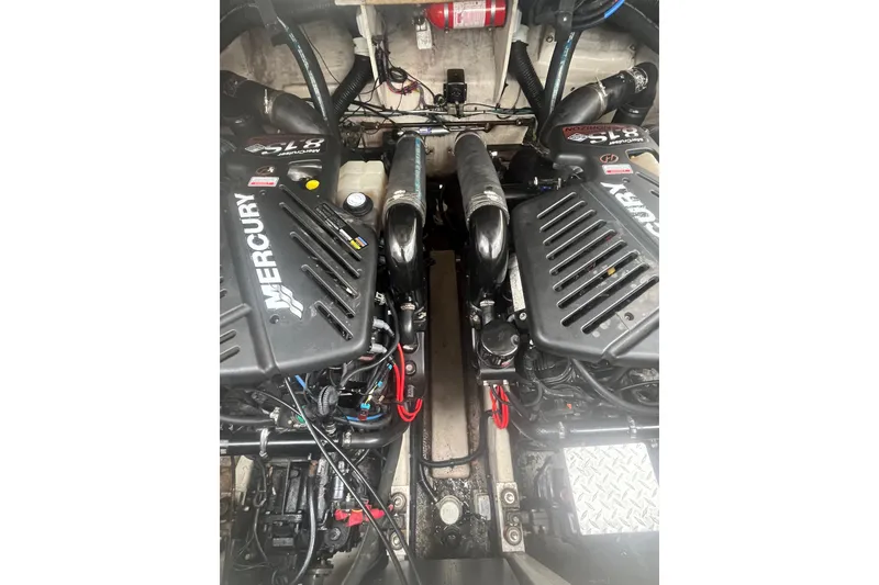 Slide: The Image of Engine compartment of a 2006 Sea Ray 340 Sundancer with twin Mercury engines. - 50