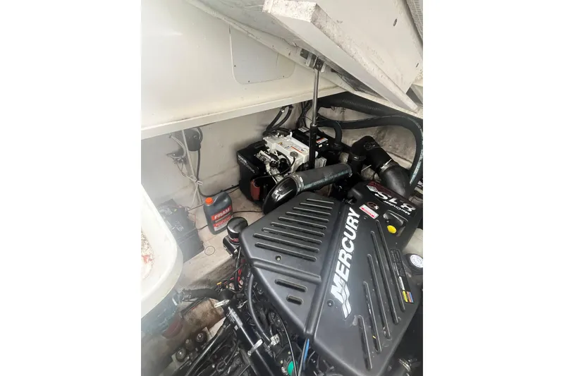 Slide: The Image of Engine compartment of a 2006 Sea Ray 340 Sundancer with Mercury components. - 52