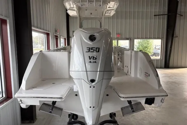 Slide: The Image of 2026 Pursuit S 248 Sport boat with 350 V6 engine in showroom. - 1