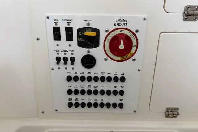 Slide: The Image of Control panel of 2026 Pursuit S 248 Sport boat with switches and dials. - 10