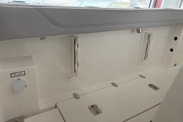 Slide: The Image of Interior view of 2026 Pursuit S 248 Sport boat, featuring storage compartments and clean design. - 13
