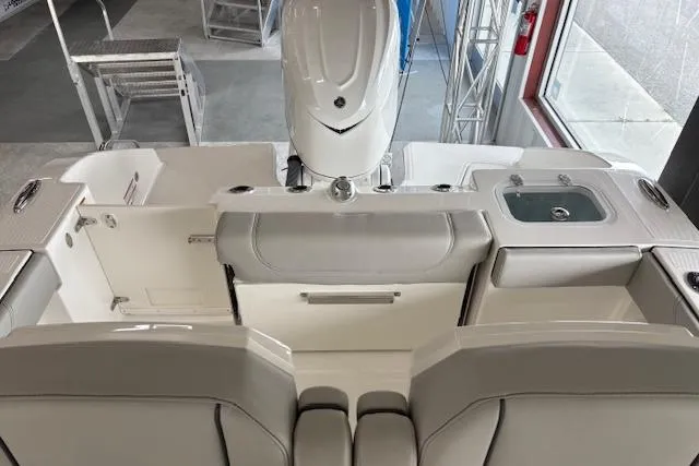 Slide: The Image of 2026 Pursuit S 248 Sport boat interior with seating and sink, showcasing modern design. - 14