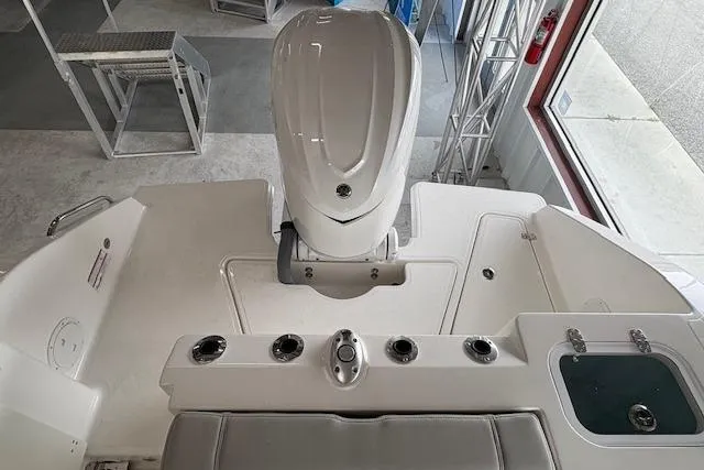 Slide: The Image of 2026 Pursuit S 248 Sport boat interior with engine and seating area. - 18