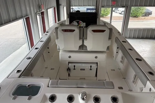 Slide: The Image of 2026 Pursuit S 248 Sport boat interior with seating and storage compartments. - 2