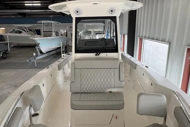 Slide: The Image of 2026 Pursuit S 248 Sport boat interior with sleek seating and modern design. - 6
