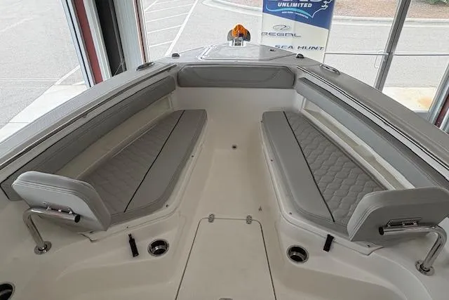 Slide: The Image of 2026 Pursuit S 248 Sport boat interior with gray seating and modern design. - 7