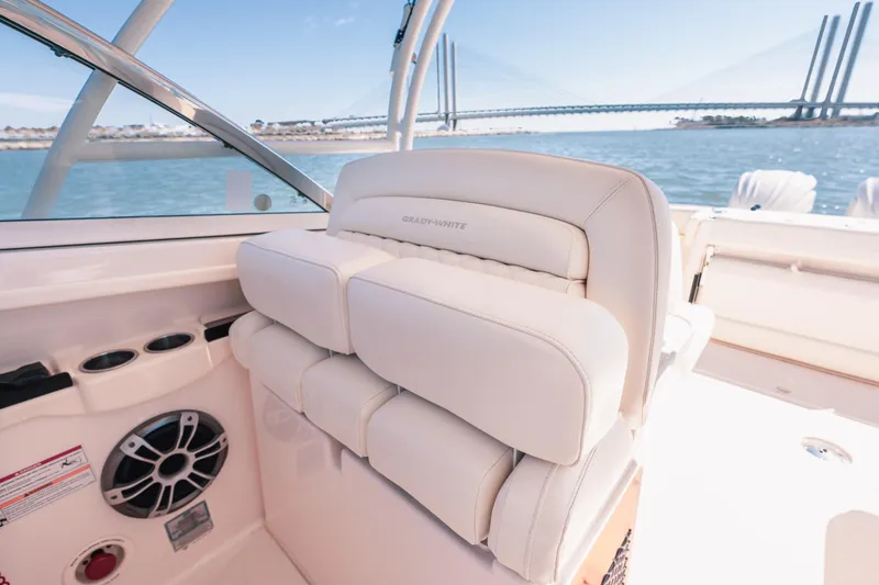 Slide: The Image of 2024 Grady-White Freedom 307 boat interior with luxurious seating and scenic water view. - 14