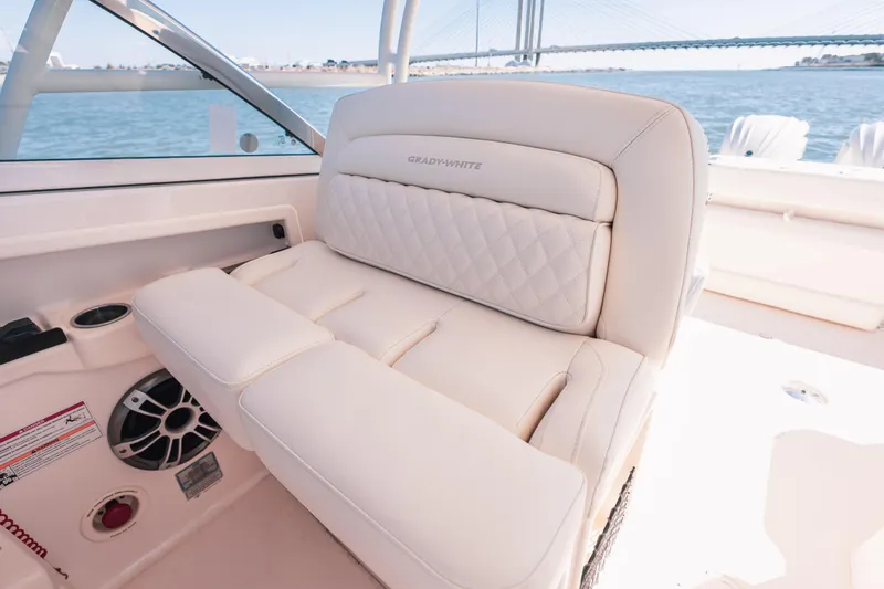Slide: The Image of Luxurious seating on 2024 Grady-White Freedom 307 boat with scenic water view. - 15